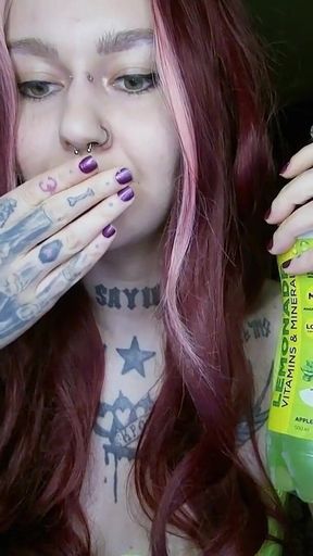 Sexy Alternative Redhead Drinking Soda and Burping