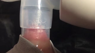 Milking milk with a breast pump to the last drop - close-up - Lactation - Milky tits