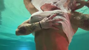 Amazon Kandy Flexes Her Massive Biceps in Her Hotel Pool