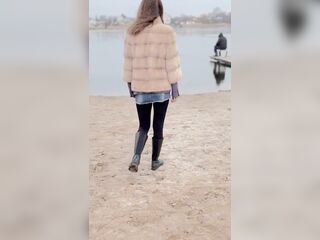 Walking along the beach out of pants.