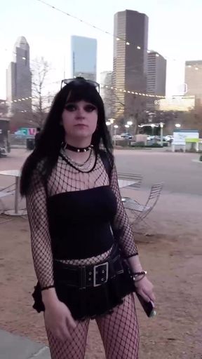 Slim goth girl has a laugh while showing off her unique style