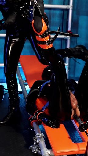 Using the Fucking Machine on the Rubber Gimp