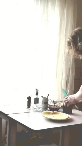 Iconic moment from &quot;Adult woman blonde in transparent negligee and beautiful cute brunette naked girl cooks in kitchen.&quot;