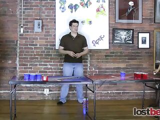 4 Charming beauties play a game of undress beer pong