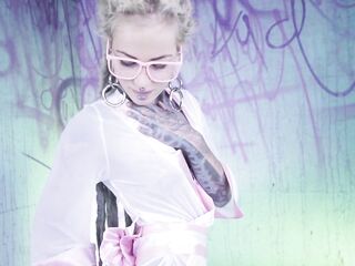Tattood Beauty with Glasses and Buttplug Screws a Tattooed Penis, double penetration, Facial