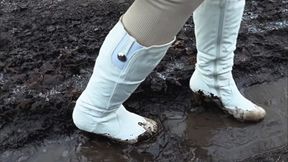Walking through a dirty puddle in white high heeled boots
