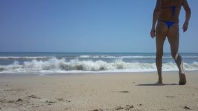 Shiny royal blue thong on the beach