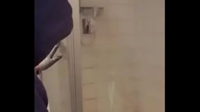 Window painter guy : Painting the slippery shower glass .