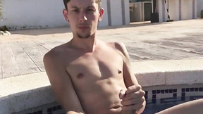 Young amateur sits in a pool & films his solo masturbation