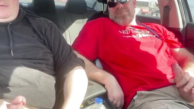 Stroking our Cocks In car in a parking lot