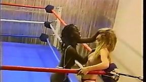 Topless interracial pro style wrestling with body slams, flips, drop kicks, scissors, kicks, knees