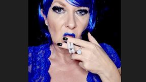 Close up double Marlboro Red 100 smoke with electric blue lips, blue wig in sexy royal blue Body