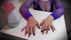 Dark red fingernails and gold rings