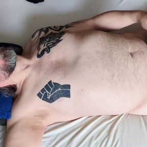 German Chubby Sub lying on bed and wanking