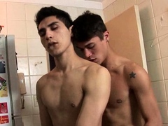 Two horny twinks get it on in the kitchen