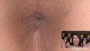 Asian girl spreads cheeks for close-up anal pleasure