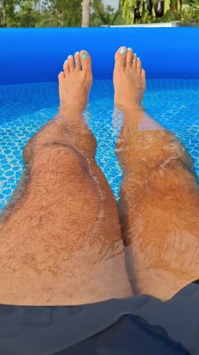 Posing my wet legs and feet by the pool before I jerk off and cum