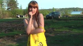 Magnificent redhead beauty in yellow dress flashes goodies outdoors