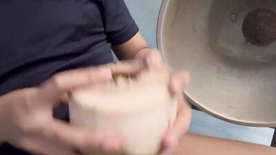 Thai guy make coconut milk.