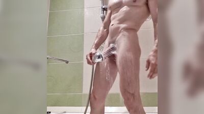 Fit dude with chiseled muscles jerks off in the shower