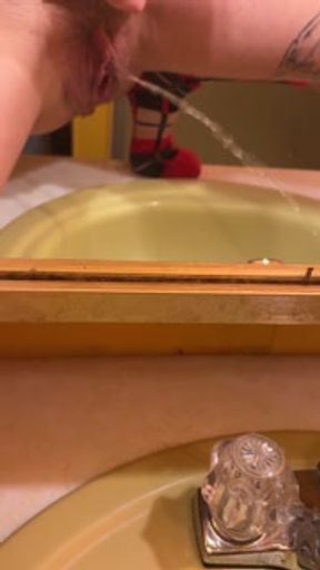 Piss Slut video recording well pissing in sink!