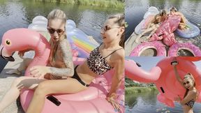 Nastya and Chloe blowing inflatables on the river