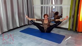 Regina Noir. A woman in a leopard bodysuit and latex leggings is doing yoga in the gym. Yoga in sexy leotards. 1