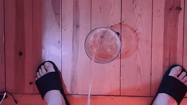 two amateur boys pissing in a glass (one is obviously too horny and hard to be able to pee :)
