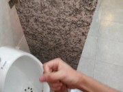 Cumming at public urinal
