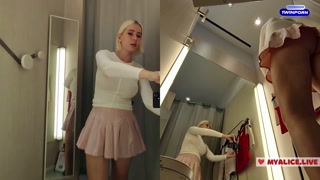 Changing in a public locker room. Transparent clothes on big boobs