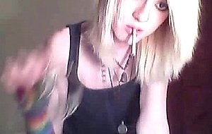 Platinum blonde emo tgirl does a bit of softcore posing