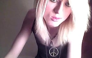 Platinum blonde emo tgirl does a bit of softcore posing