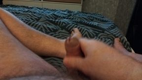 My friend's boyfriend is lying in bed jerking off and playing with his little cock