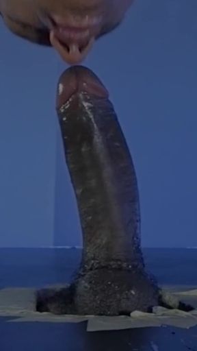 Sucking a Huge Black Cock in a Glory Hole