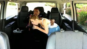Blonde hussy gives head to a black dude in a minivan