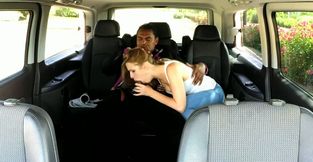 Blonde hussy gives head to a black dude in a minivan