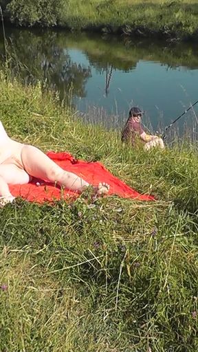 Iconic moment from &quot;Nudist beach. Public nudity. Sexy MILF without panties and bra sunbathes naked is not shy about&quot;
