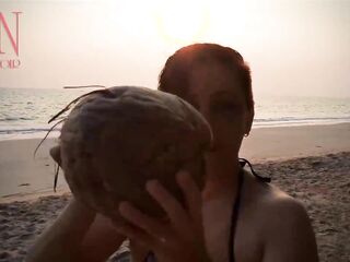 Wonderful lady at lonely nudist beach. Red swimsuit. Red bikini. Coconut