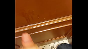 Blond teen jerks off and cums in public restroom