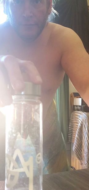 Lee Przybylowicz hiding his baby dick behind a water bottle