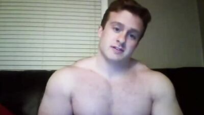 Beefy dude is posing naked and jerking off in front of the camera