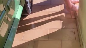 Dragging a car while completely naked.