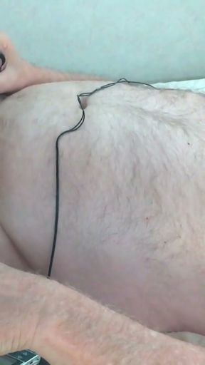 Hands free cumshot. Bound and stretched balls are swollen and shocked with estim along with nipples and cock   Clip 2