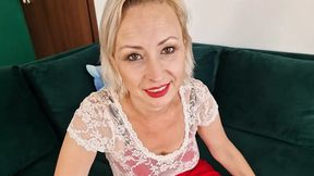 Wanilianna is sitting on the green sofa  She's wearing copper seamed nylon stockings and vintage bullet-bra