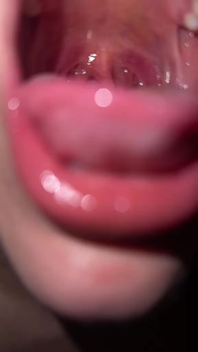 Close-up of a person's mouth with red lipstick