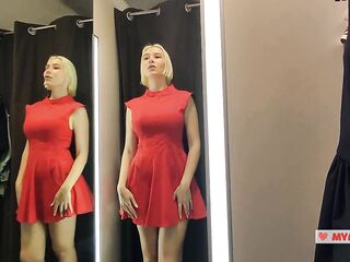 Bare beauty with a large boobs in the public locker room, try on transparent garments