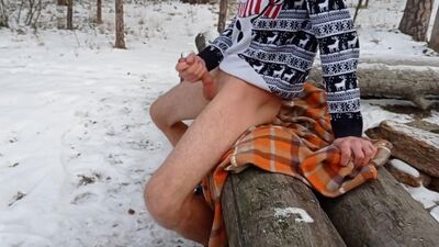 The guy jerked off and finished in the snowy forest