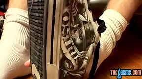 Thug jock Evan Heinze caressing socks in foot fetish solo