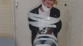 Tonny tied up in a chair