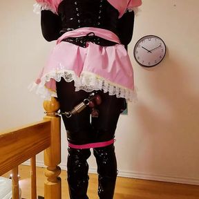 Sissy Maid in Spiked Chastity Cage Cuffed to Bed Post